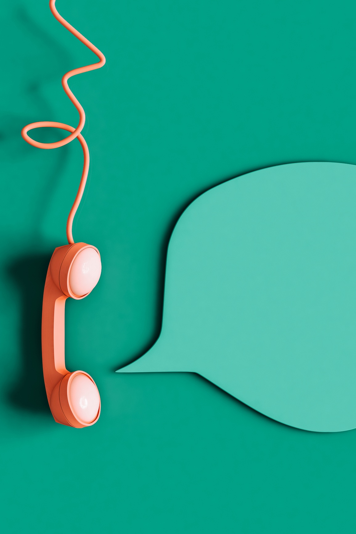An orange telephone receiver against a teal backdrop.